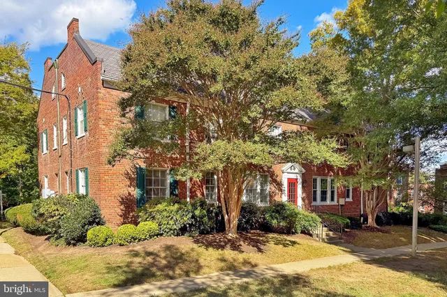 a view of a building with a yard