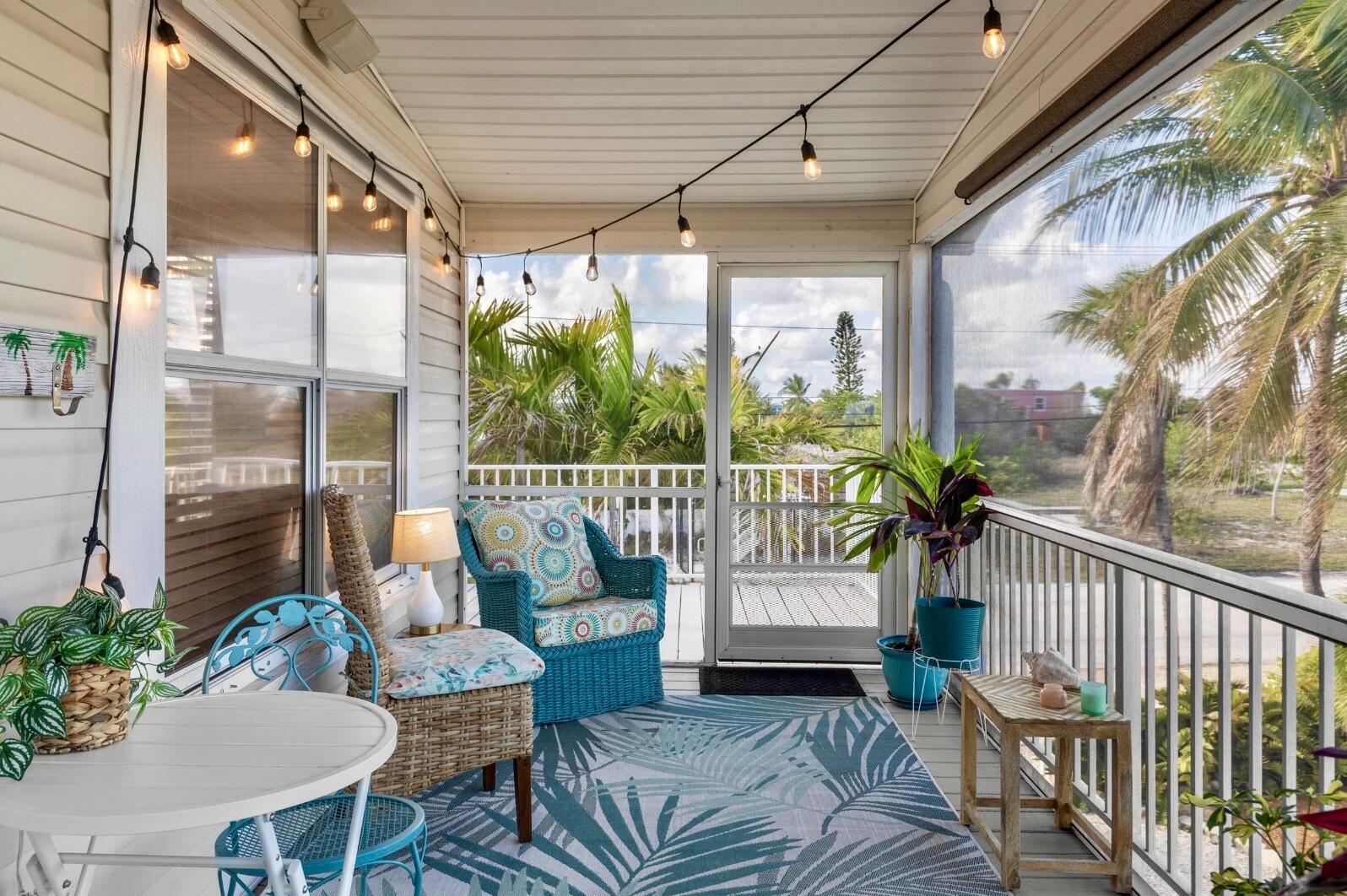 157 Mars Lane Key West, FL 33040 - Photo 5 of 41 a balcony with furniture and a potted plant