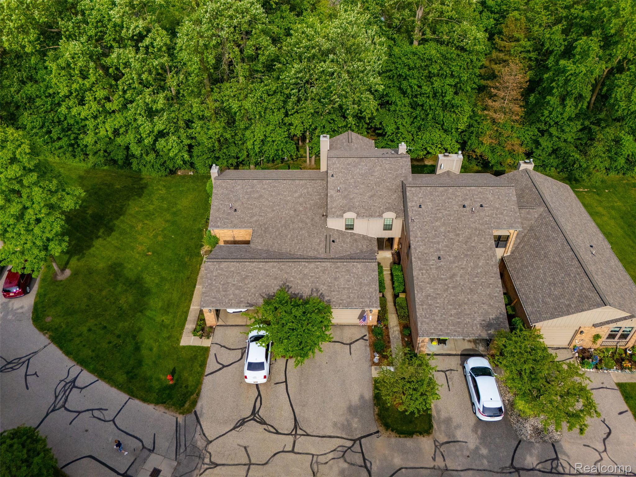 1687 Lodge Pole Lane Rochester, MI 48309 - Photo 35 of 53 Multi-level roofline with shingle roofing and multiple chimneys