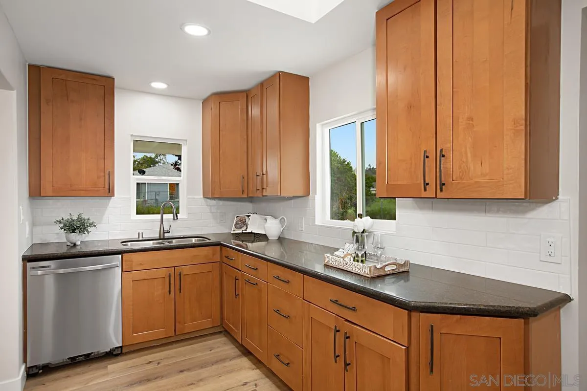 9350 Rapture Lane Santee, CA 92071 - Photo 13 of 30 a kitchen with a sink and cabinets