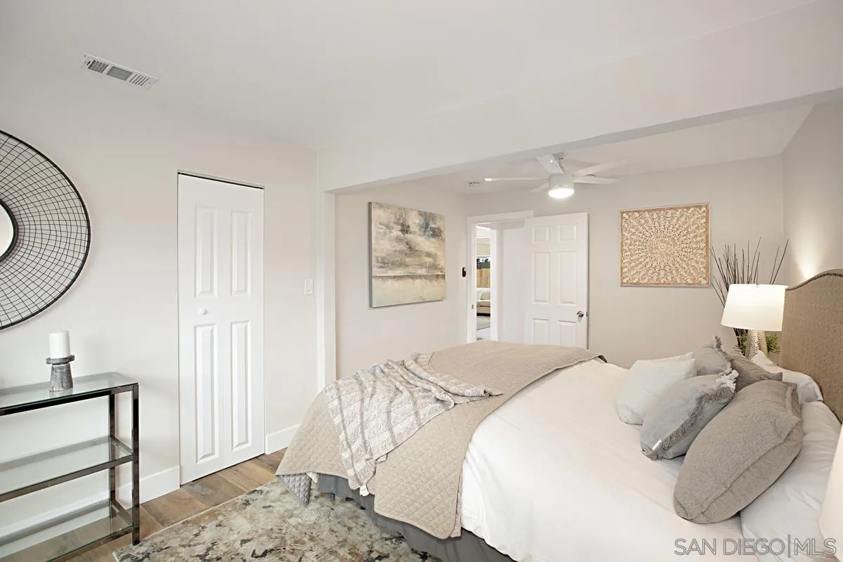 9350 Rapture Lane Santee, CA 92071 - Photo 16 of 30 a bedroom with a bed and a mirror