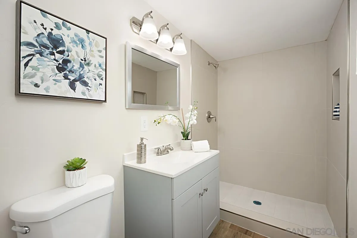 9350 Rapture Lane Santee, CA 92071 - Photo 17 of 30 a bathroom with a sink mirror and toilet