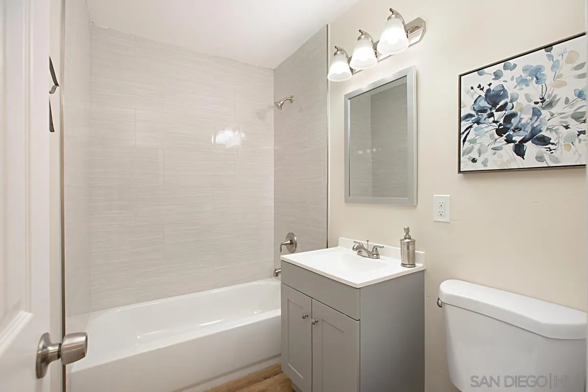 9350 Rapture Lane Santee, CA 92071 - Photo 19 of 30 a bathroom with a sink mirror vanity and toilet