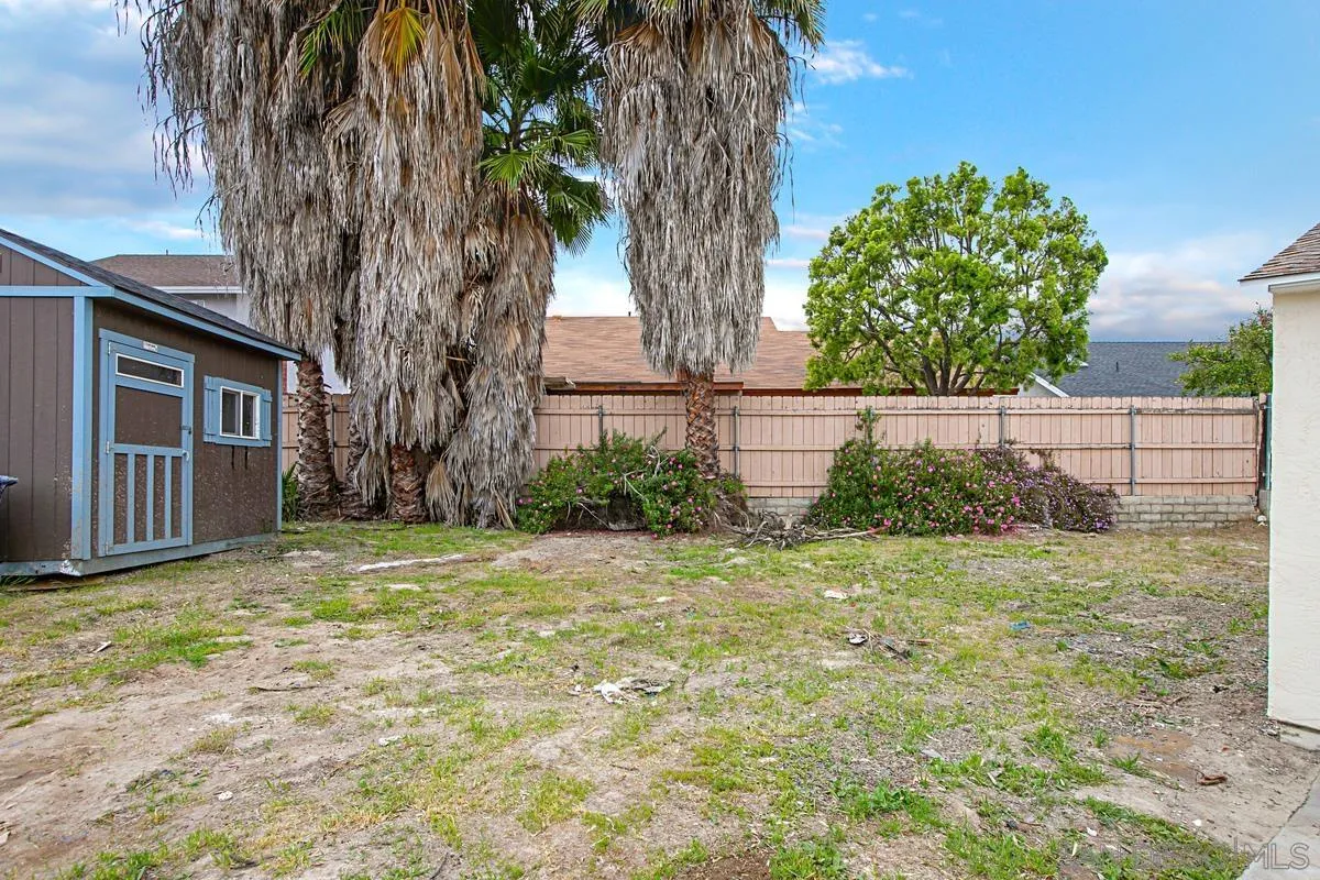 9350 Rapture Lane Santee, CA 92071 - Photo 25 of 30 a view of a backyard with a large tree