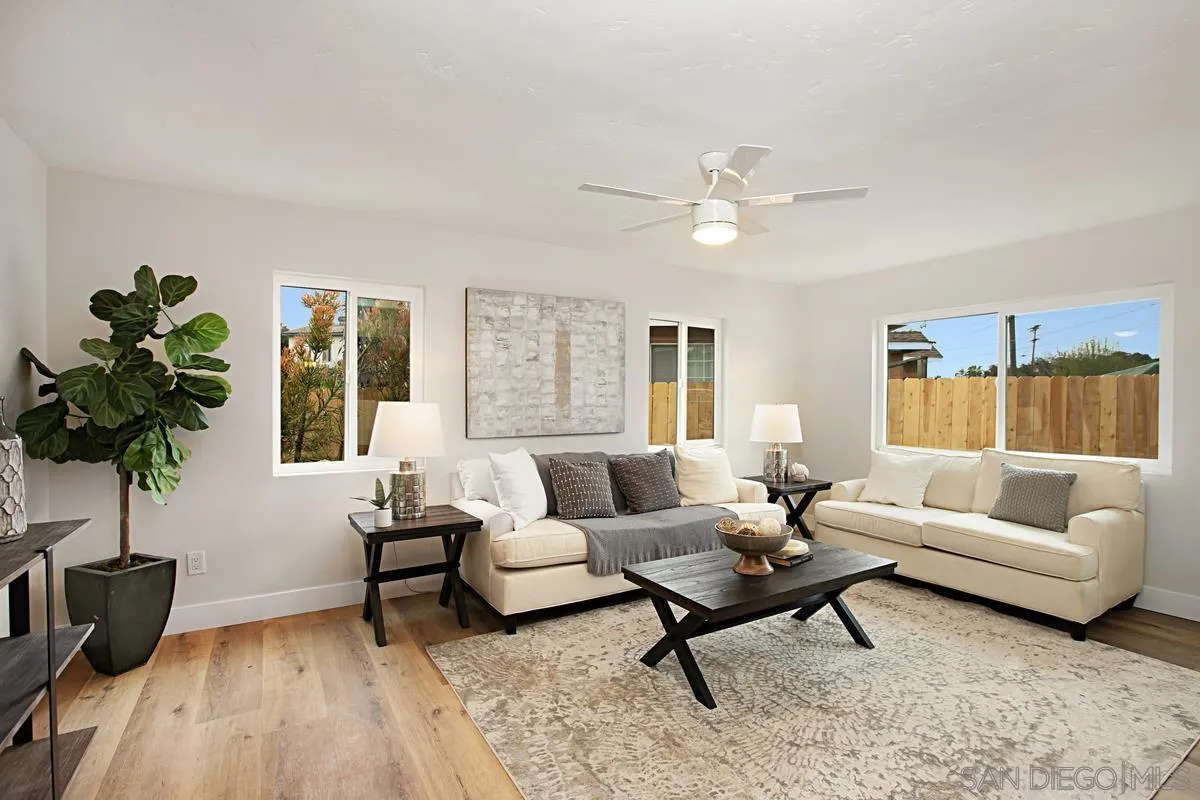 9350 Rapture Lane Santee, CA 92071 - Photo 6 of 30 a living room with furniture and a potted plant