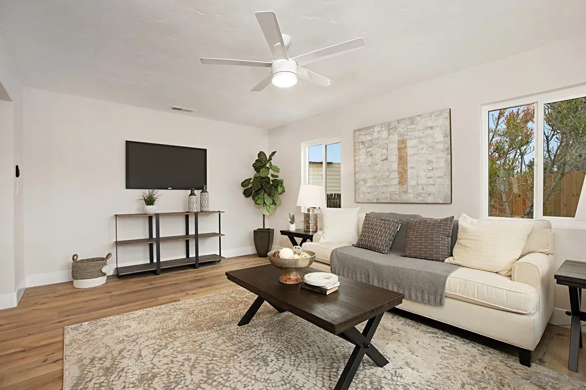 9350 Rapture Lane Santee, CA 92071 - Photo 7 of 30 a living room with furniture a flat screen tv and a window