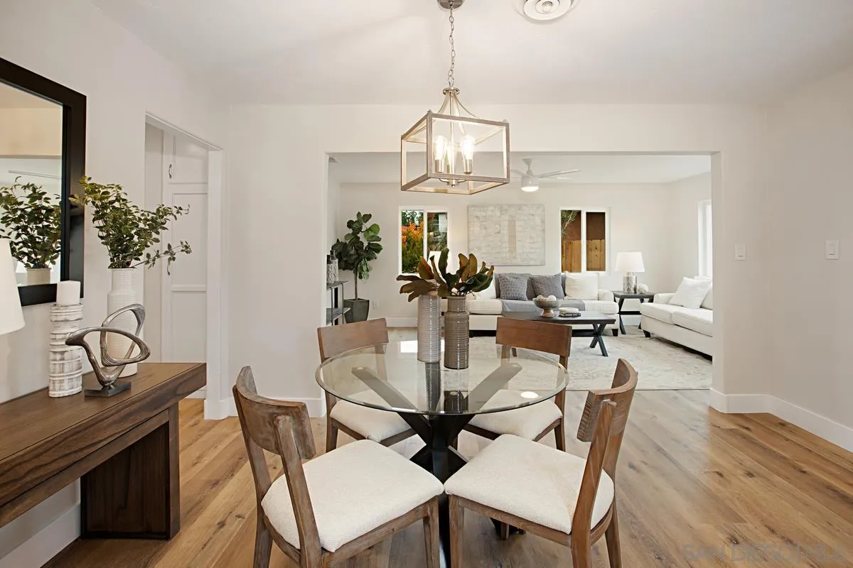 9350 Rapture Lane Santee, CA 92071 - Photo 10 of 30 a view of a dining room with furniture wooden floor and chandelier