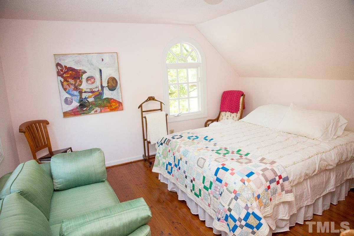 395 Cecil Road Wendell, NC 27591 - Photo 12 of 29 a bedroom with a bed couch and a window