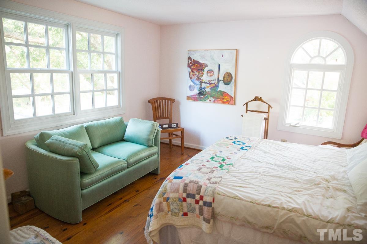 395 Cecil Road Wendell, NC 27591 - Photo 13 of 29 a bedroom with bed and a large window