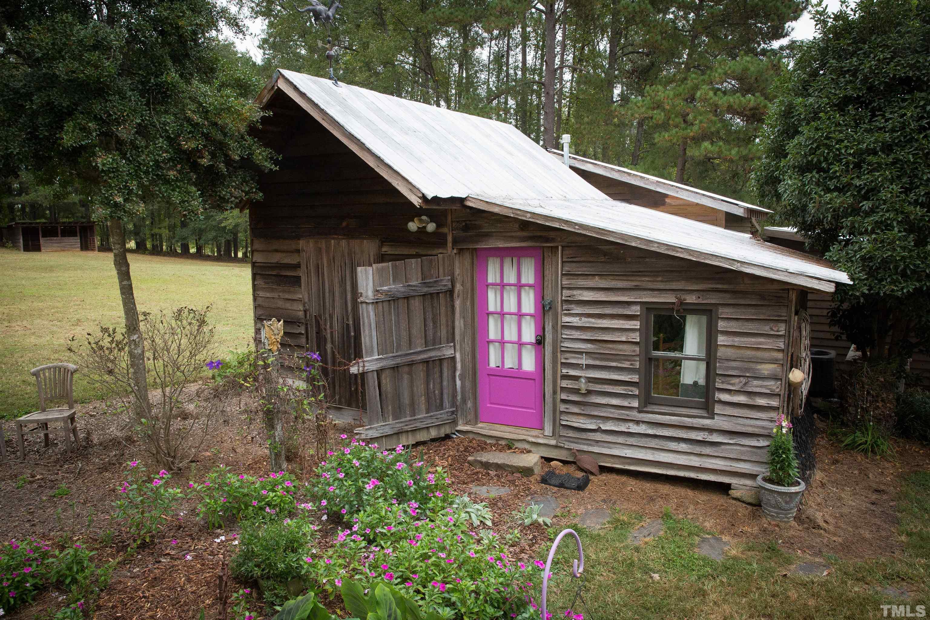 395 Cecil Road Wendell, NC 27591 - Photo 16 of 29 a yellow house with a small yard and fence