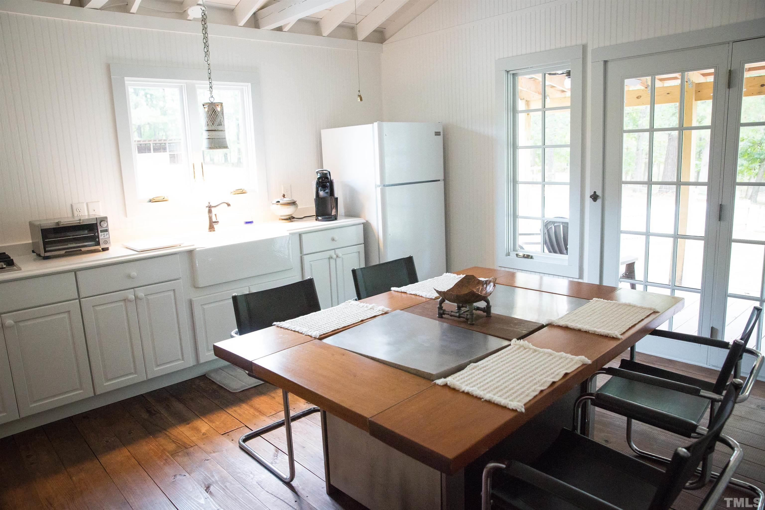 395 Cecil Road Wendell, NC 27591 - Photo 17 of 29 a view of a dining room with furniture window and wooden floor