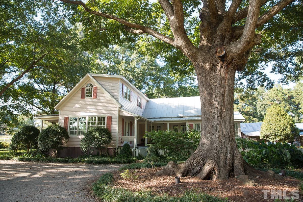 395 Cecil Road Wendell, NC 27591 - Photo 3 of 29 a front view of a house with garden