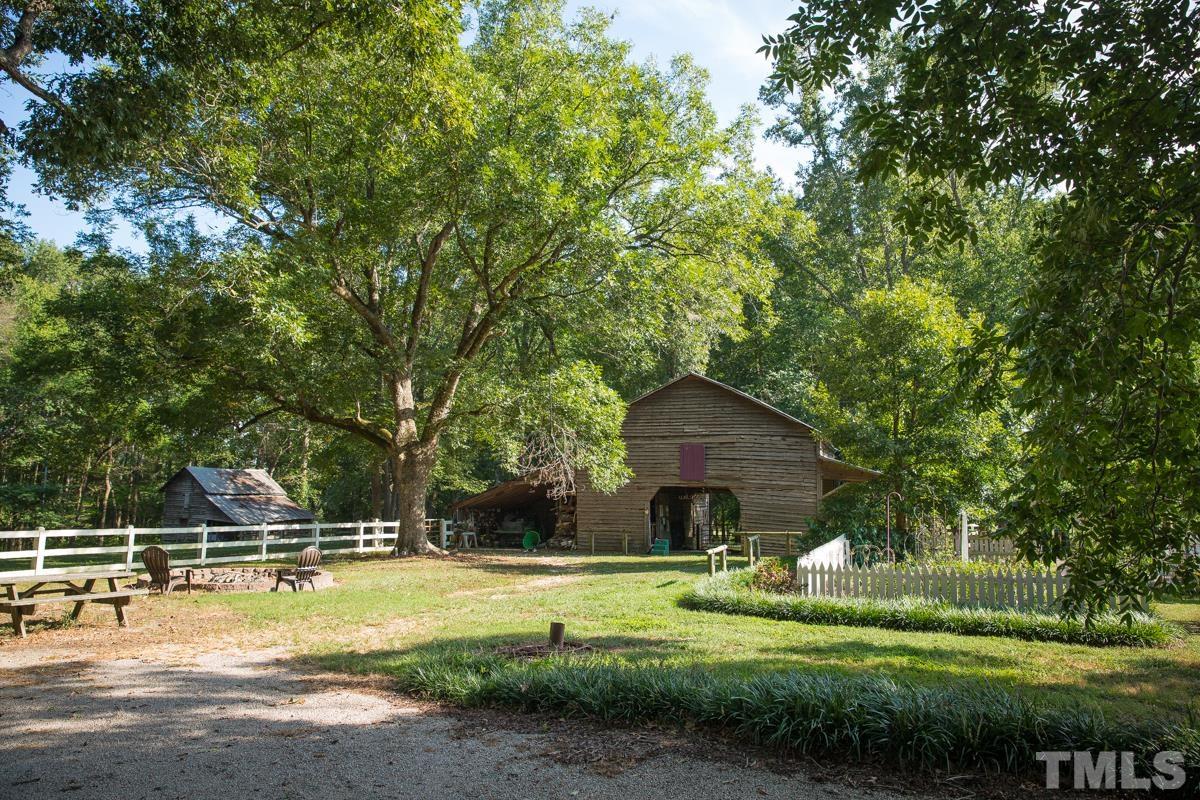 395 Cecil Road Wendell, NC 27591 - Photo 23 of 29 a view of a house with swimming pool and a yard