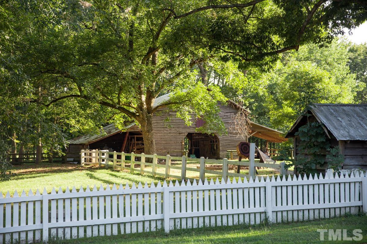 395 Cecil Road Wendell, NC 27591 - Photo 25 of 29 a view of a house with a small yard and wooden fence