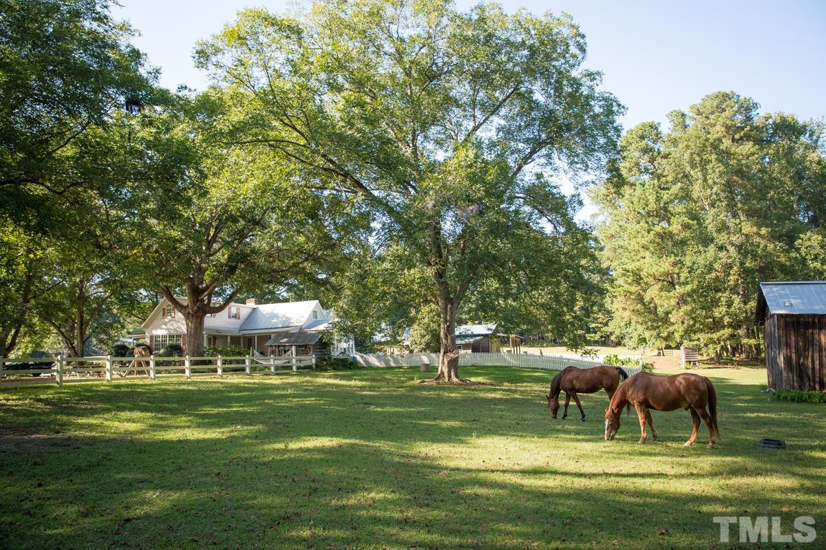 395 Cecil Road Wendell, NC 27591 - Photo 26 of 29 a view of house with garden space and trees