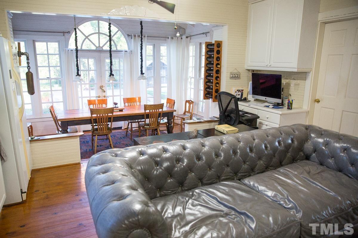 395 Cecil Road Wendell, NC 27591 - Photo 8 of 29 a living room with furniture fireplace and flat screen tv