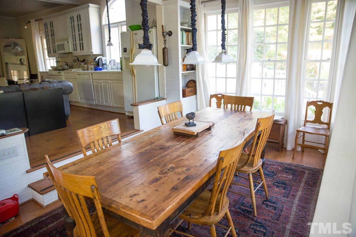 395 Cecil Road Wendell, NC 27591 - Photo 9 of 29 a view of a dining room with furniture and wooden floor