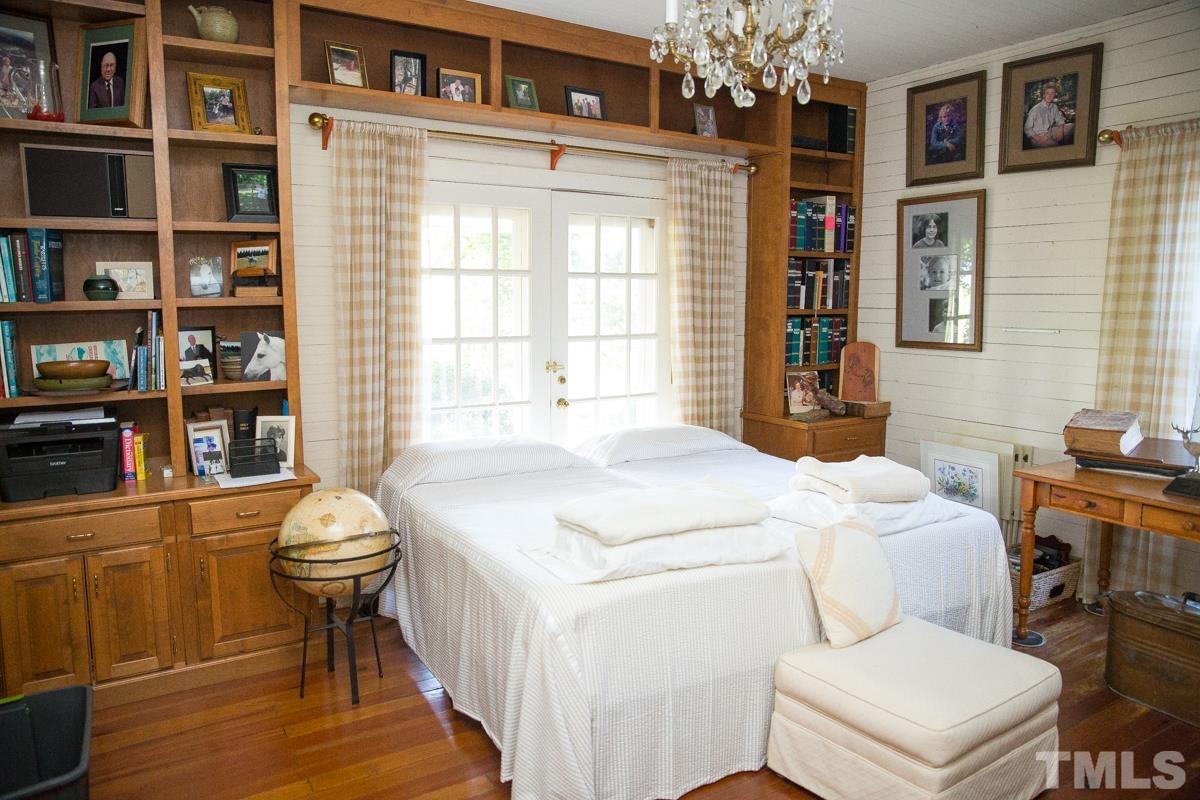 395 Cecil Road Wendell, NC 27591 - Photo 10 of 29 a bathroom with a sink a toilet and a window