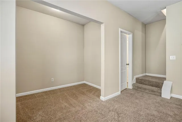 a bathroom with a toilet sink vanity and mirror