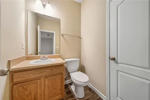 a view of empty room with a fireplace