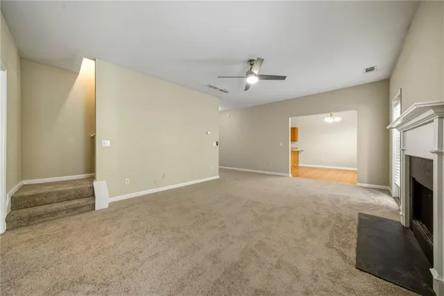 a view of a bathroom with a glass door and shower