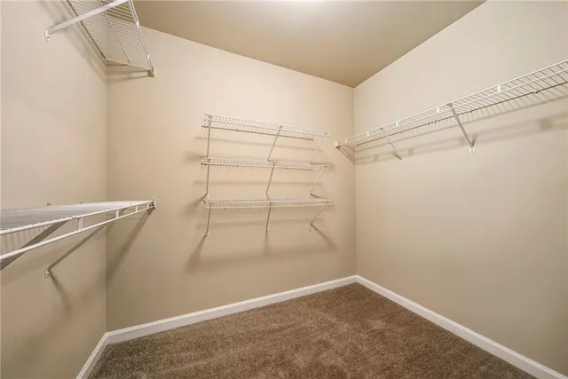 a white bath tub sitting next to a shower