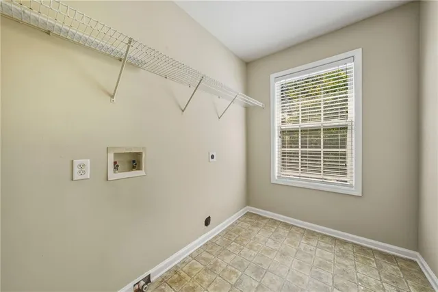 an empty room with a ceiling fan and a window