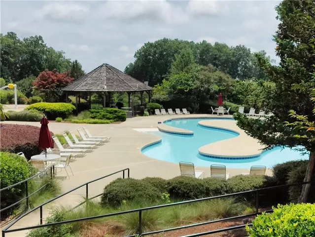 a view of a swimming pool with a garden