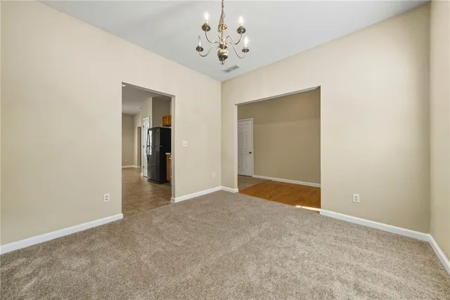 a kitchen with stainless steel appliances granite countertop a sink and cabinets with wooden floor