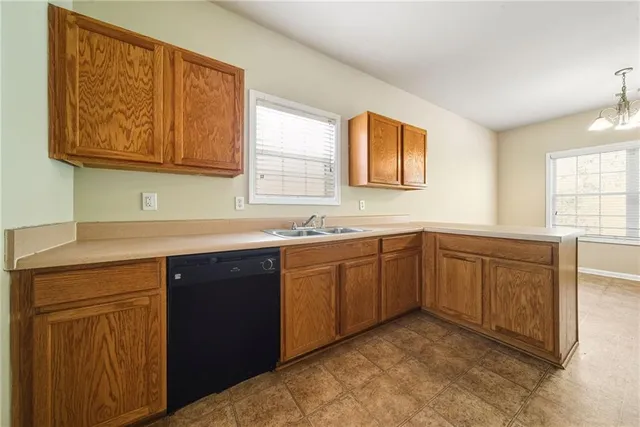 a kitchen with stainless steel appliances granite countertop a refrigerator stove and microwave