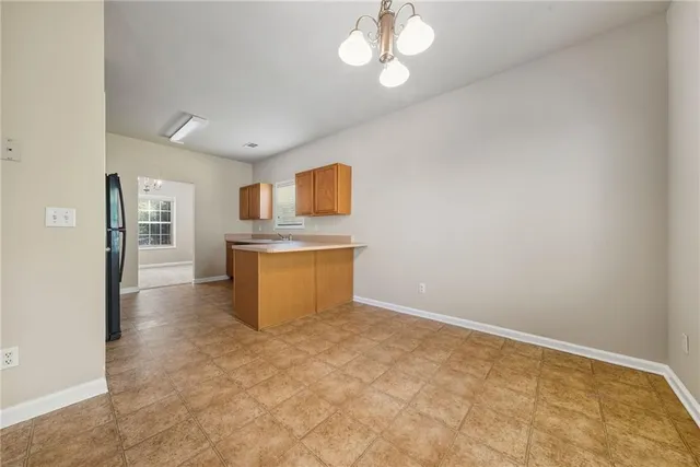 a large bathroom with a sink a mirror and a shower