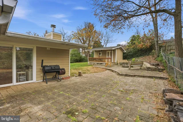 a view of a outdoor space with a patio and backyard