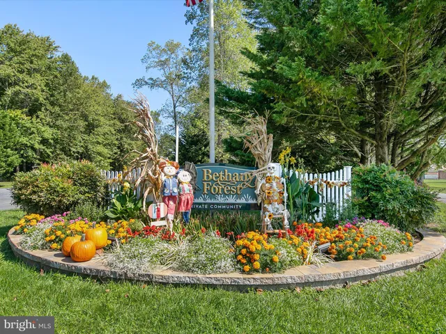 a view of house with swimming pool outdoor seating
