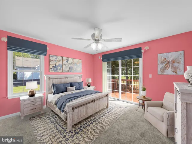 a bedroom with a large bed and a couch