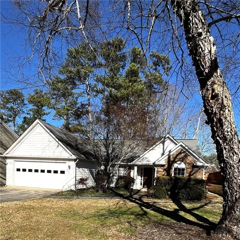 front view of a house with a yard