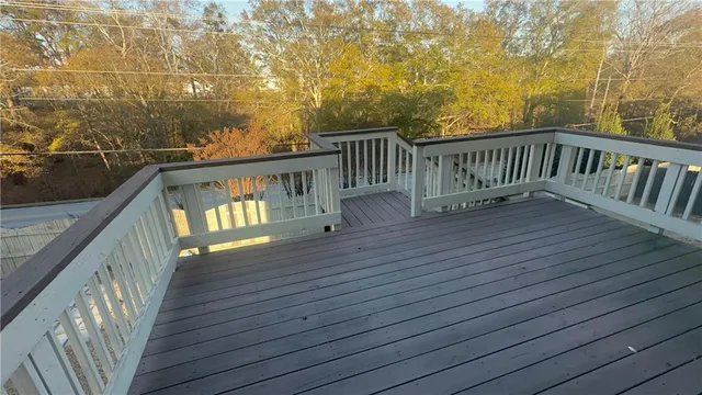 a view of a balcony with wooden floor