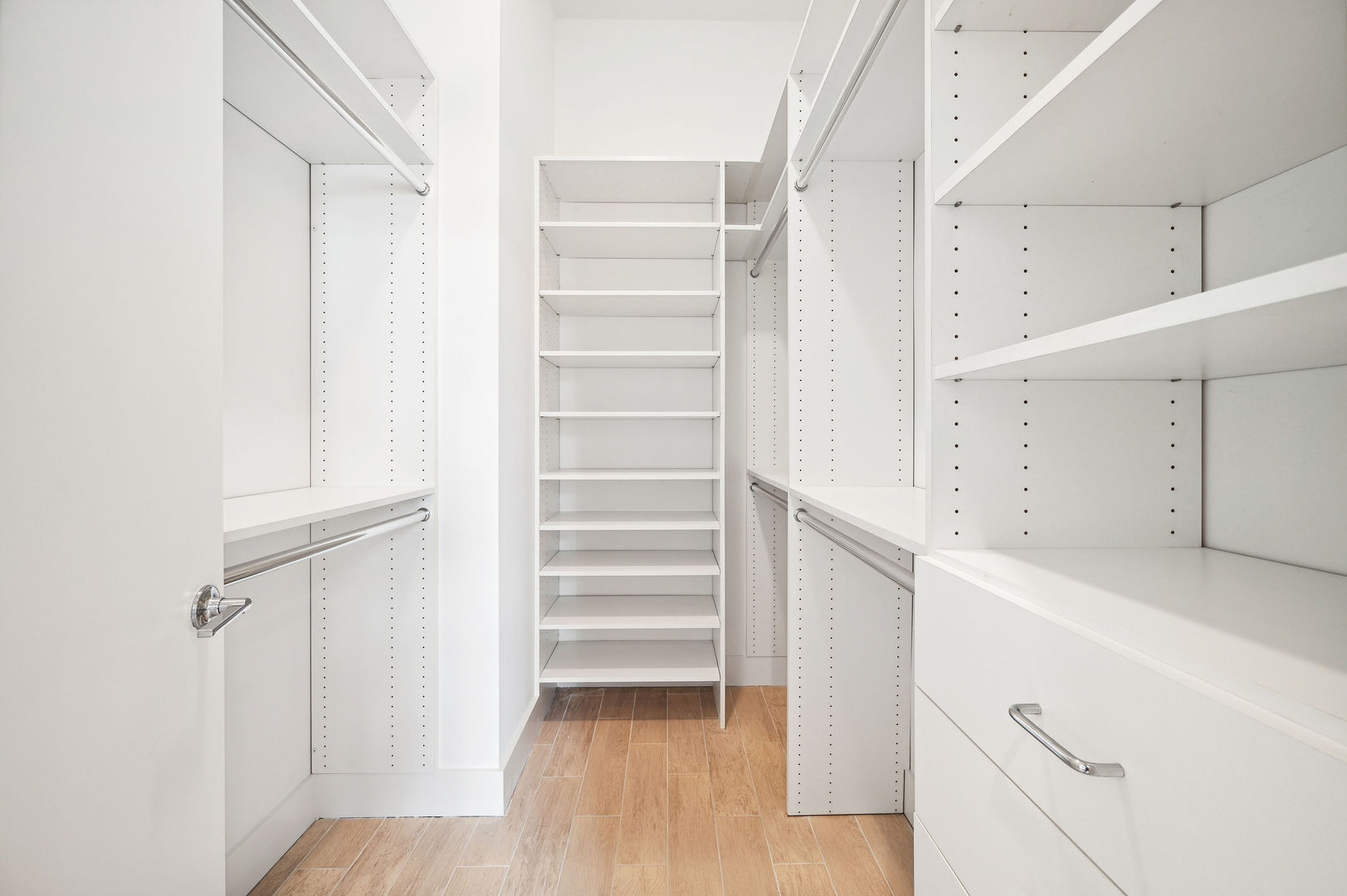 16 North Carpenter Street, Unit 2S Chicago, IL 60607 - Photo 16 of 21 a view of walk in closet with empty racks