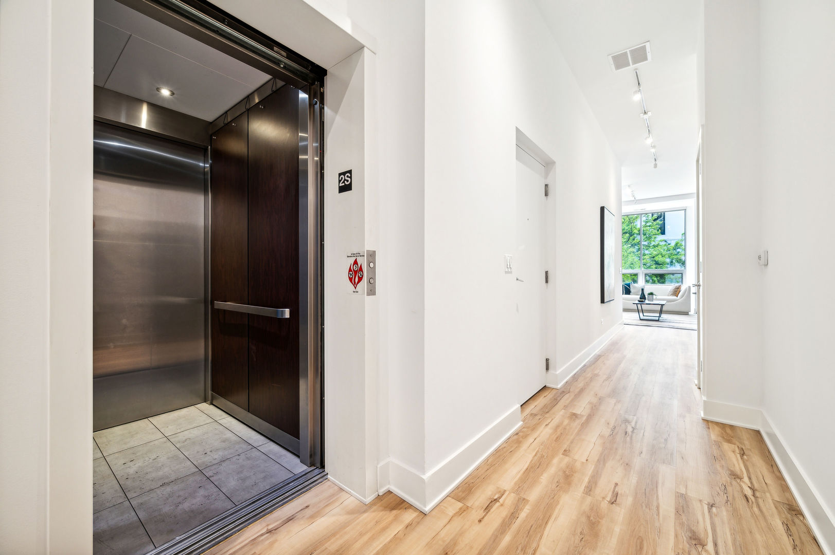 16 North Carpenter Street, Unit 2S Chicago, IL 60607 - Photo 2 of 21 a view of hallway with wooden floor
