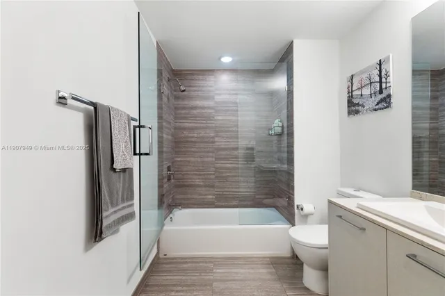 a bathroom with a bathtub toilet and sink