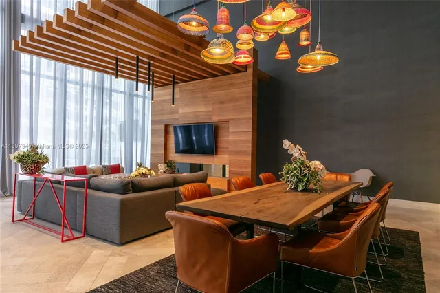 a view of a dining room with furniture and window