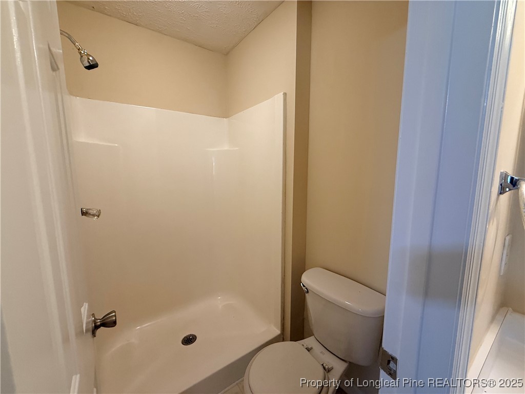 203 Cypress Drive Raeford, NC 28376 - Photo 15 of 21 a bathroom with a toilet and a shower