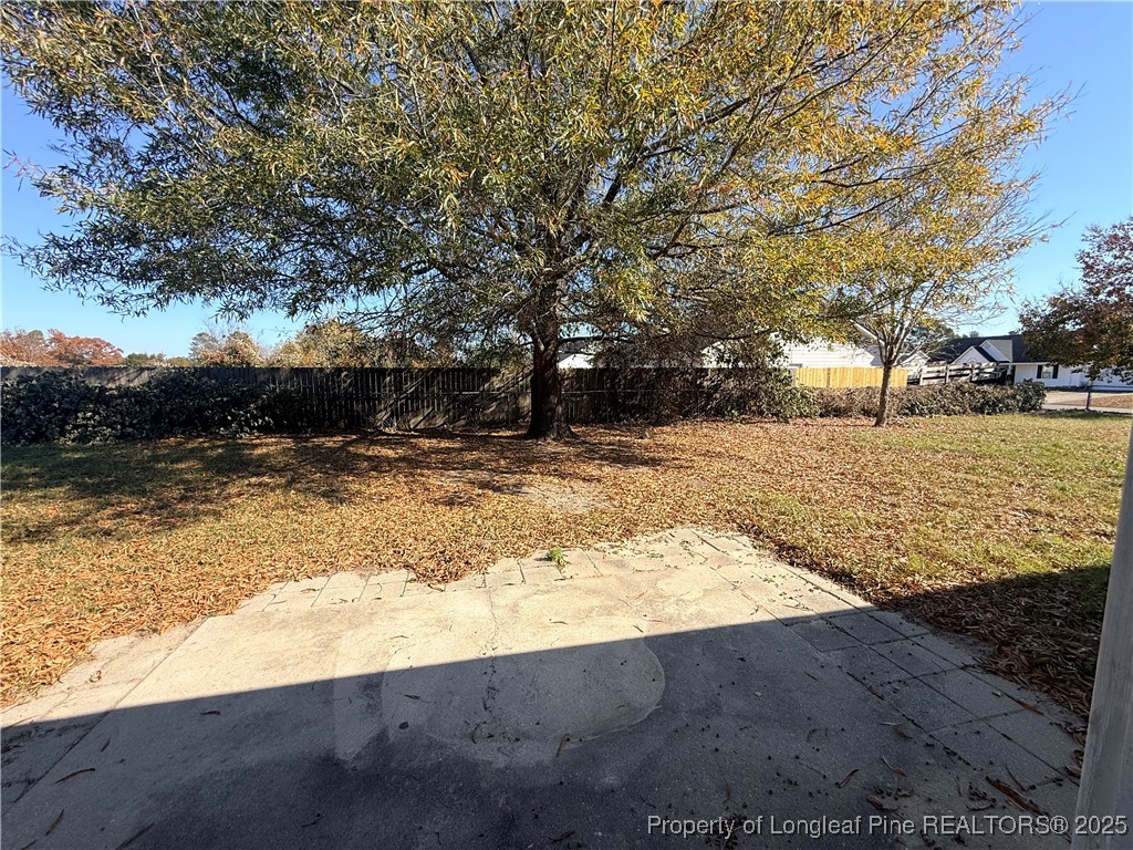 203 Cypress Drive Raeford, NC 28376 - Photo 18 of 21 a view of a yard with trees