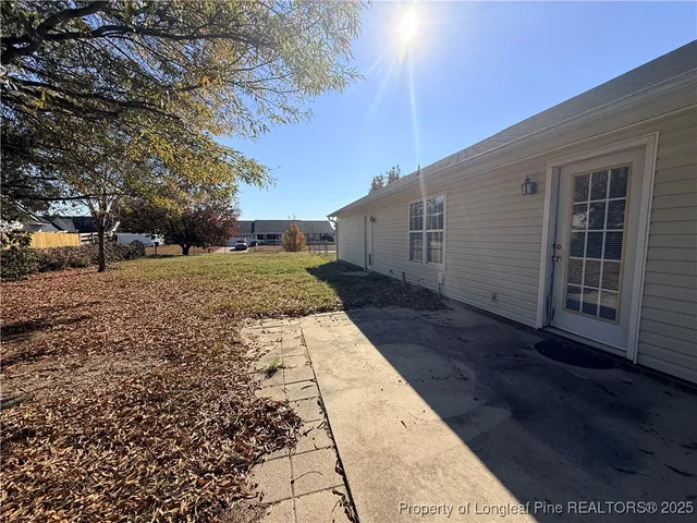 a view of a backyard of the house