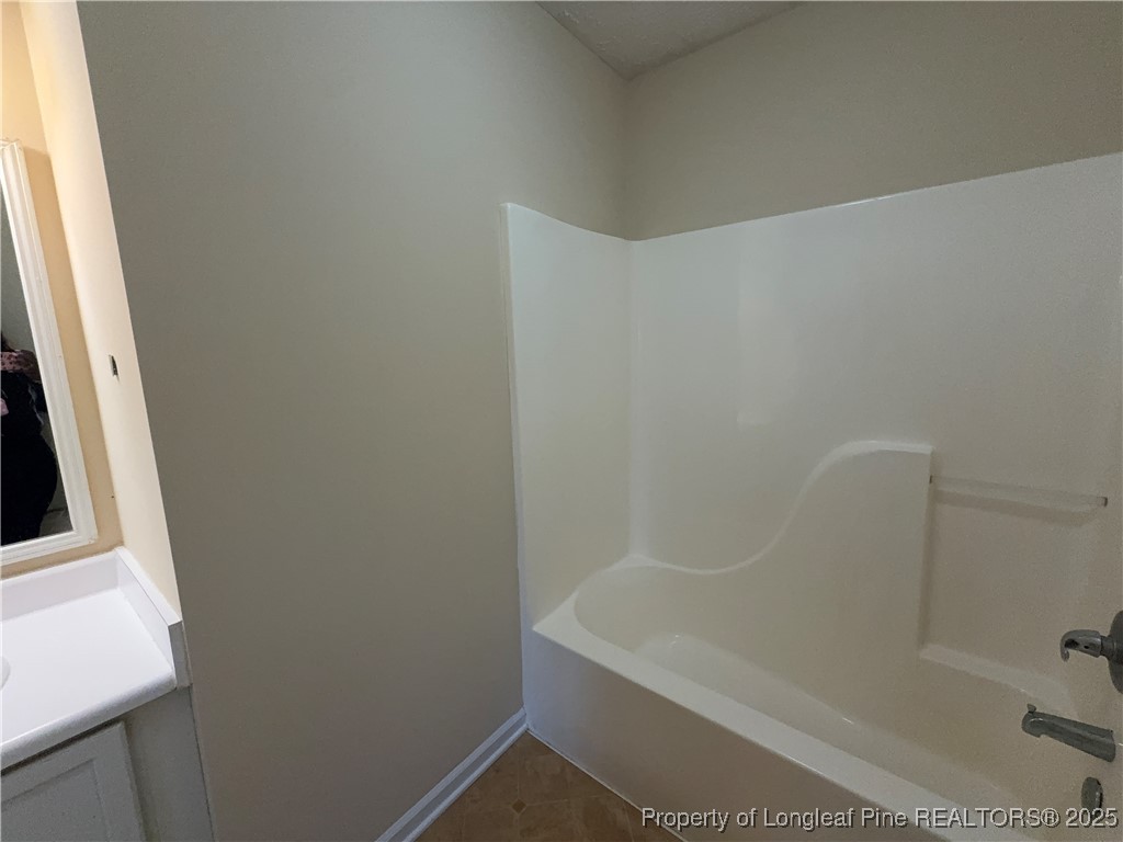 203 Cypress Drive Raeford, NC 28376 - Photo 9 of 21 a bathroom with a bathtub