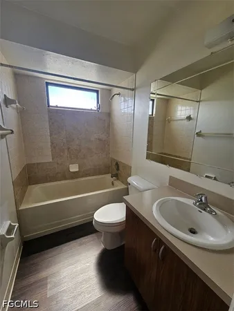 a bathroom with a sink a toilet and bathtub