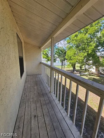 a view of balcony with wooden floor