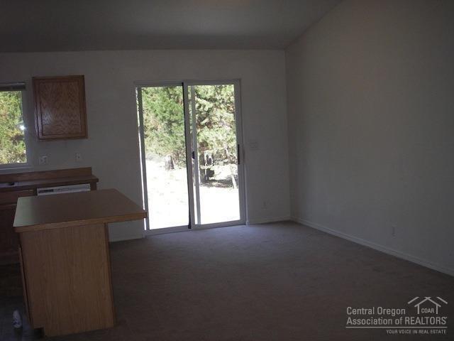17196 Tholstrup Road Bend, OR 97707 - Photo 3 of 12 The dining area is part of the great roo