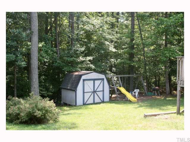 3412 Gibson Road Durham, NC 27703 - Photo 5 of 6 Storage shed for extra space and numerous hours of enjoyment on the play set. Wooded backyard for privacy.