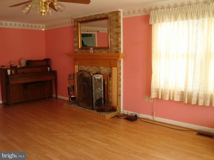1544 Pine Ridge Road Inwood, WV 25428 - Photo 3 of 30 Living Room with wood burning fireplace