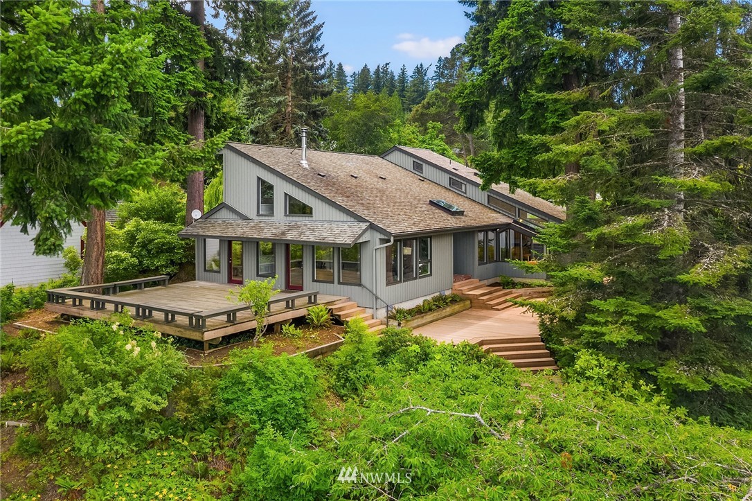 4730 Spring Street Bellingham, WA 98229 - Photo 2 of 30 a aerial view of a house with swimming pool next to a big yard